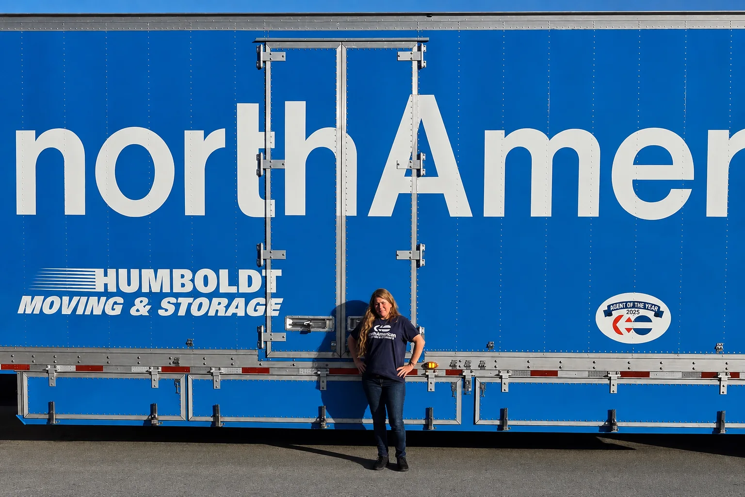 Christine Kizina, North American Van Lines’ 2025 Driver of the Year, beside a Humboldt Moving & Storage trailer.