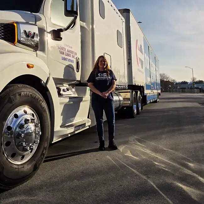 Humboldt team member beside a North American Van Lines moving truck
